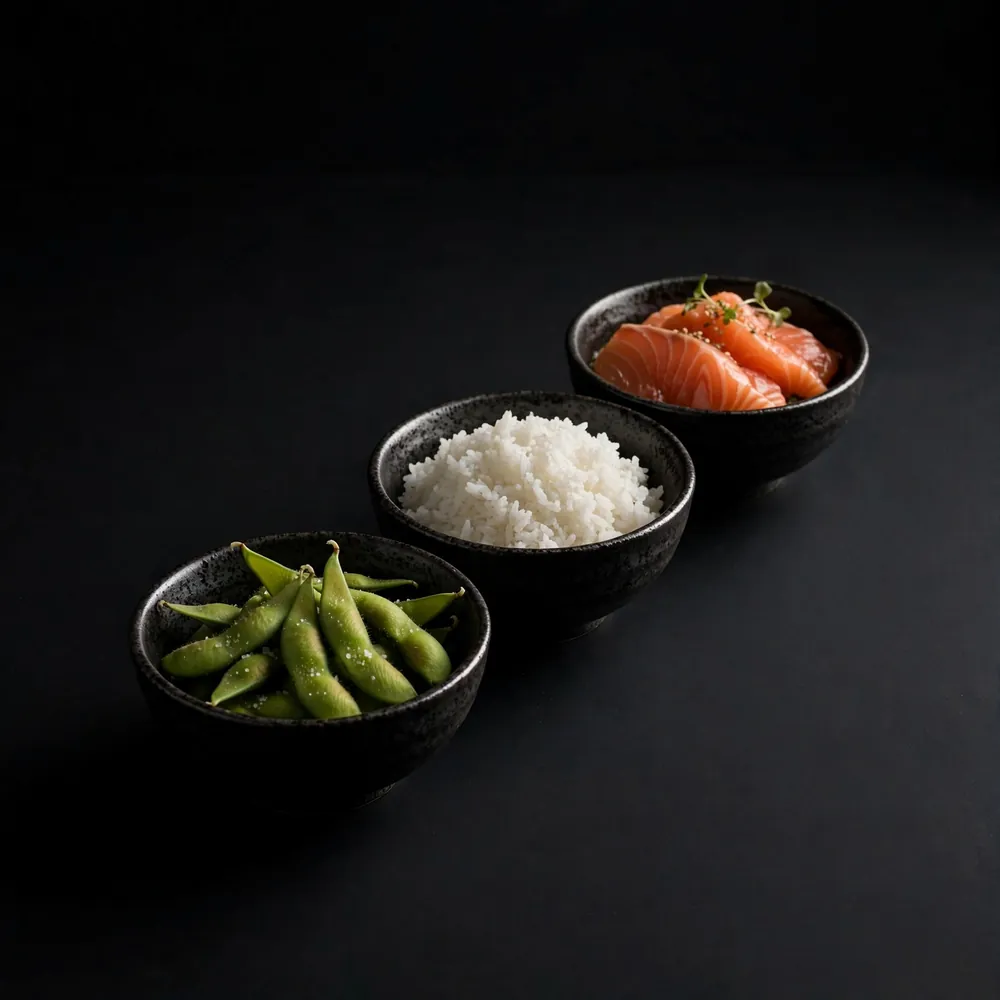Three bowls of sashimi, rice and edamame